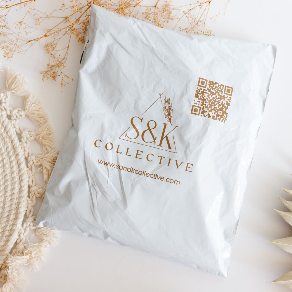 S&K Collective bag with decorative elements on a light background